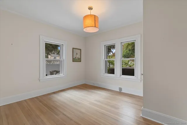 a view of room with wooden floor and window