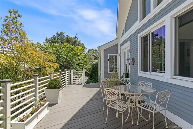 a view of a chair and table in the balcony