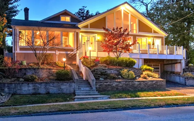 a front view of a house with a yard