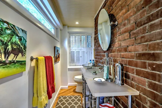 a view of a dining room with furniture and a floor to ceiling window
