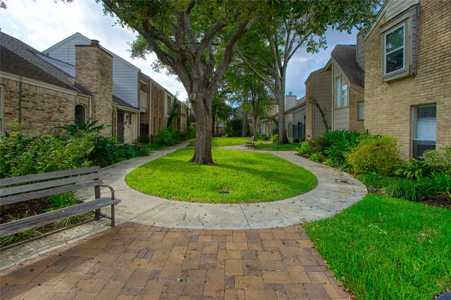 a view of a garden with a house