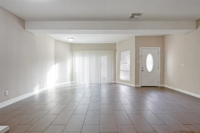 a view of an empty room and window