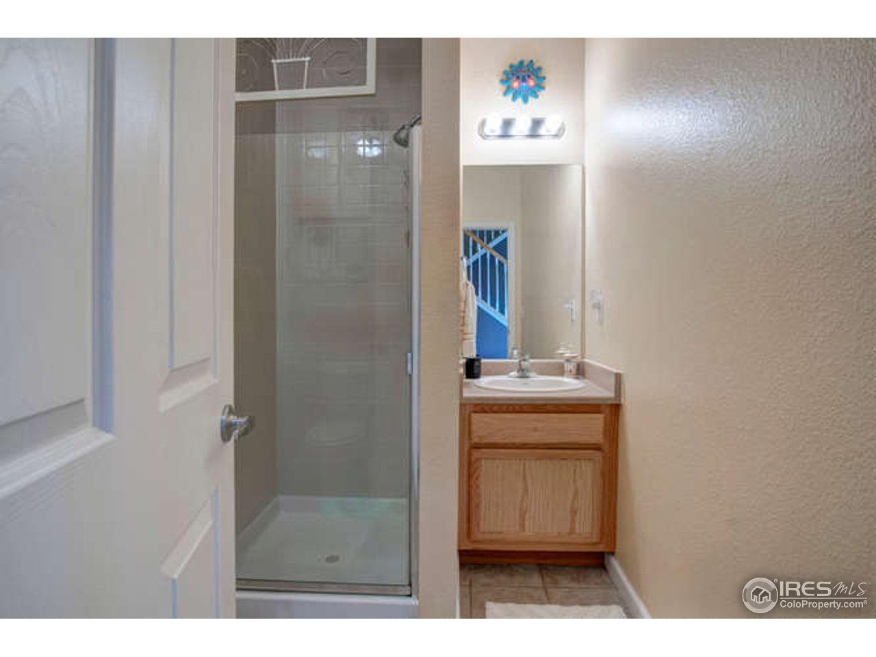 4202 Riley Drive Longmont, CO 80503 - Photo 18 of 25 3/4 bath on main level