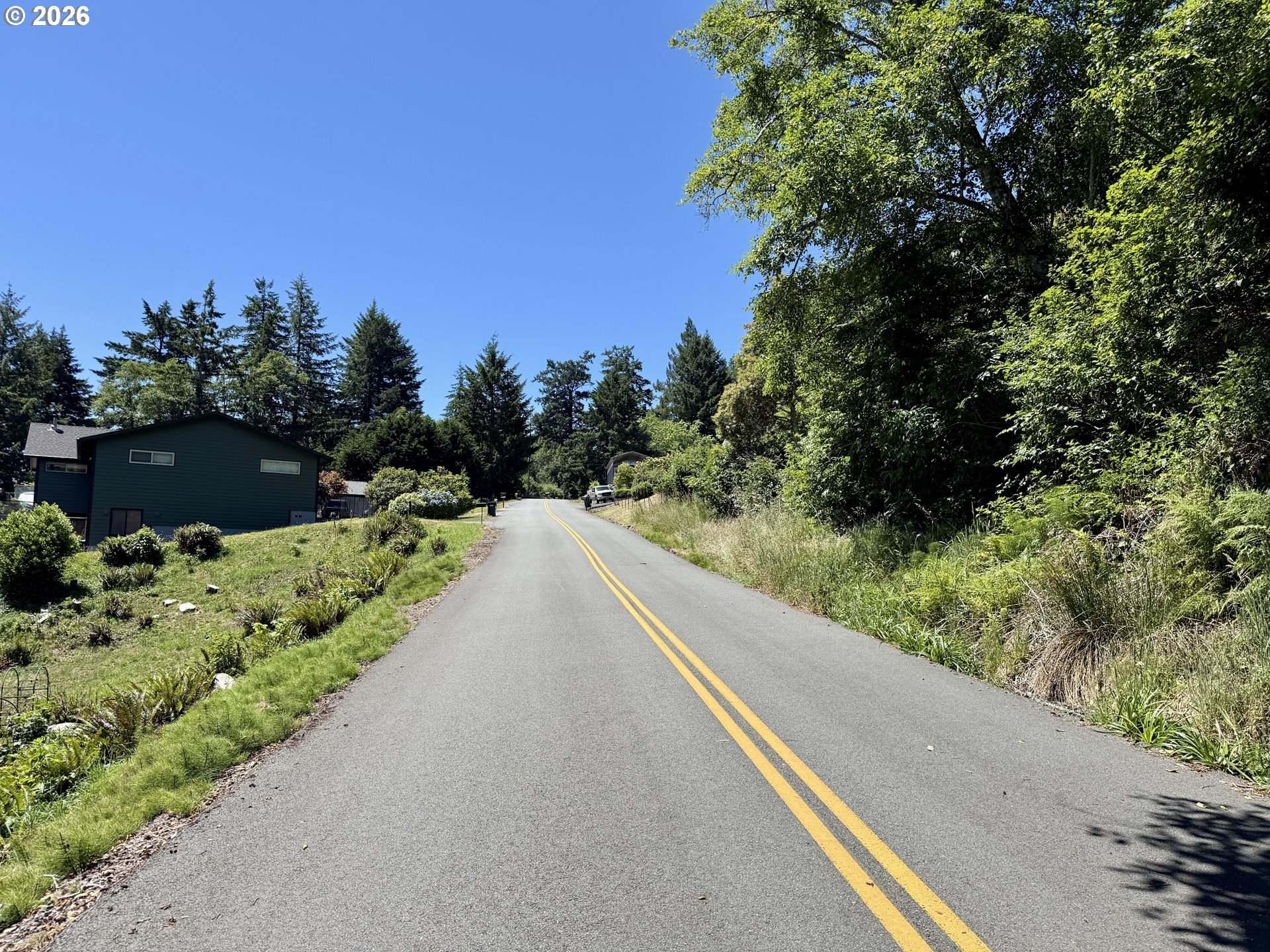 0 Thompson Road Brookings, OR 97415 - Photo 15 of 15 a view of a road with a yard