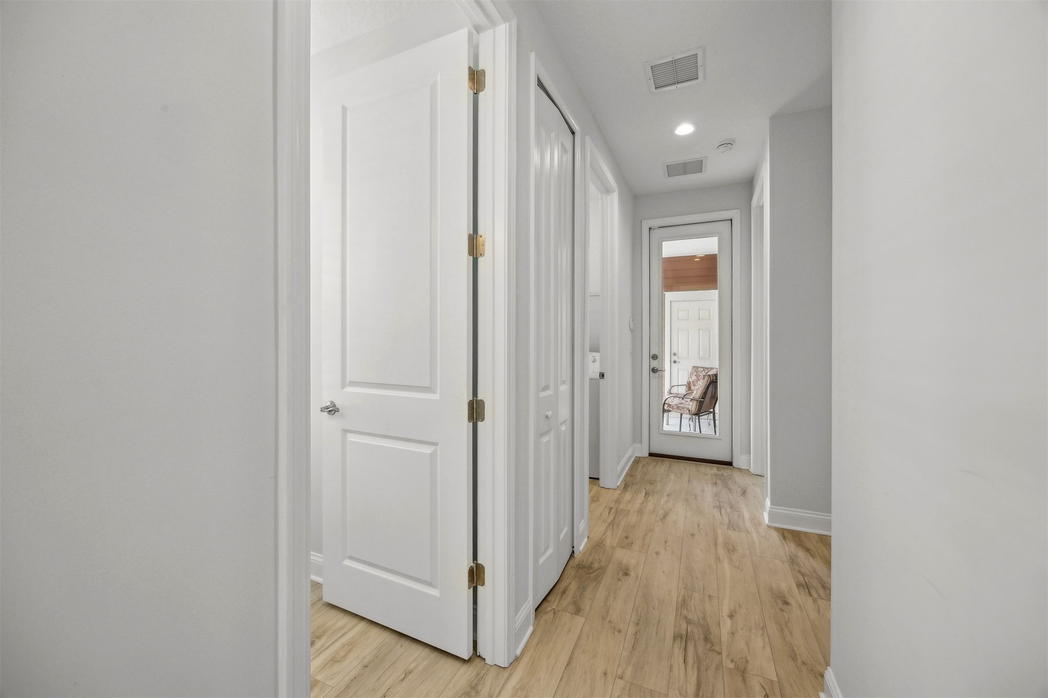 230 Wildlight Avenue Yulee, FL 32097 - Photo 12 of 73 a view of a hallway with wooden floor
