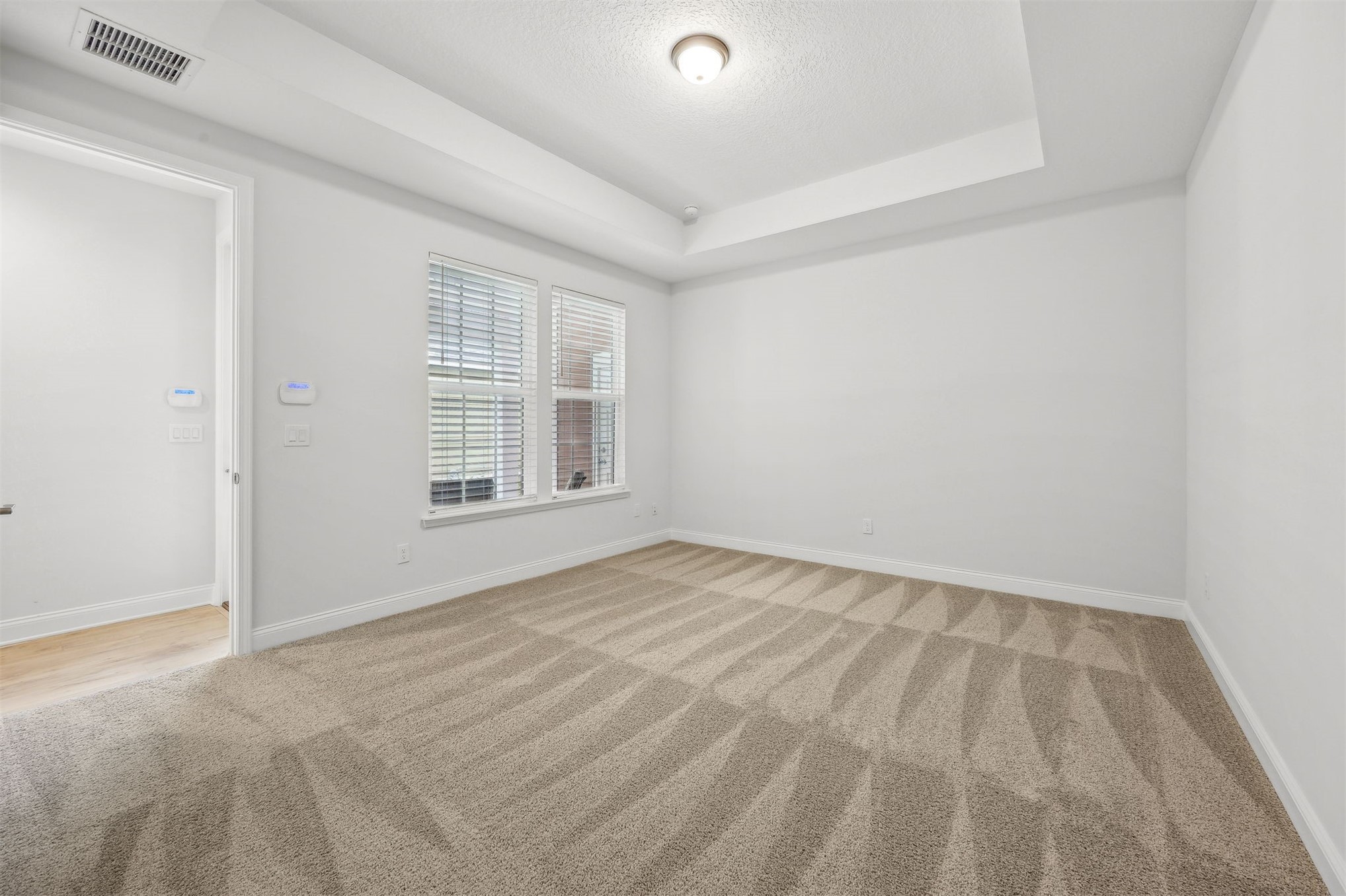 230 Wildlight Avenue Yulee, FL 32097 - Photo 18 of 73 a view of an empty room with a window