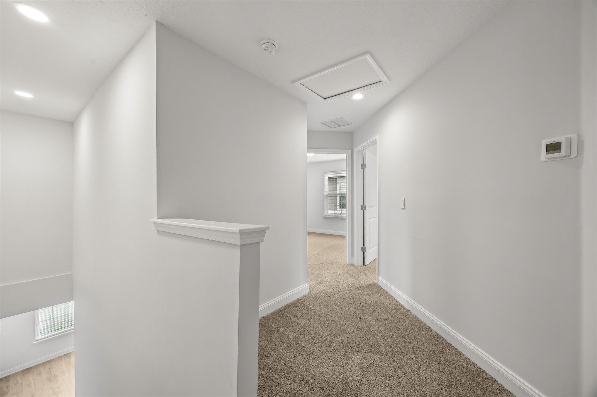 230 Wildlight Avenue Yulee, FL 32097 - Photo 23 of 73 a view of a hallway with wooden floor