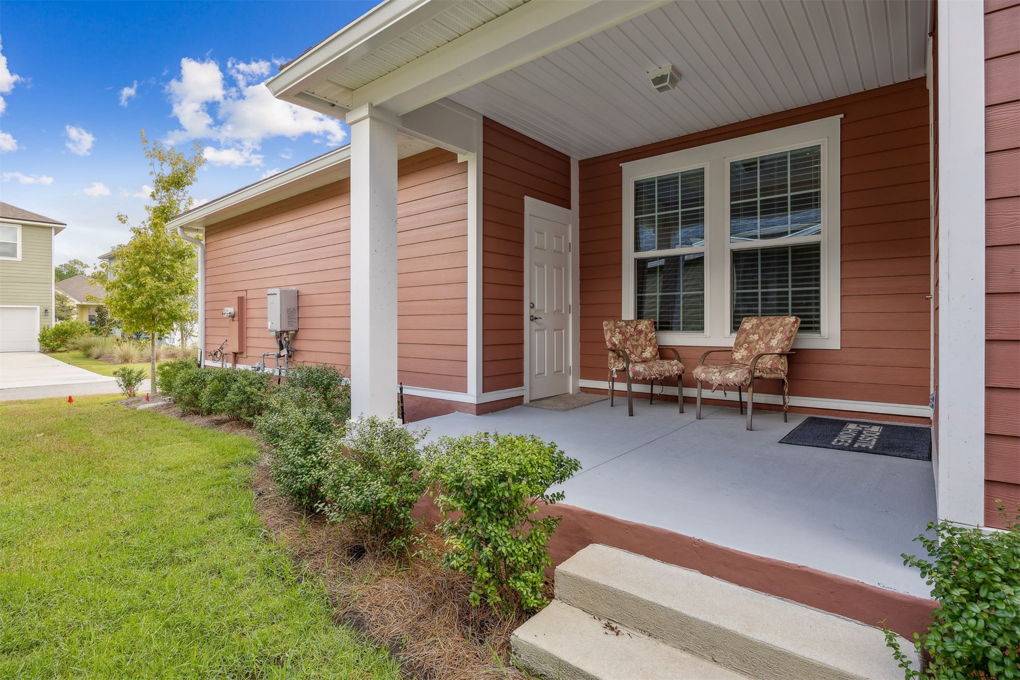 230 Wildlight Avenue Yulee, FL 32097 - Photo 32 of 73 a house view with a sitting space and garden
