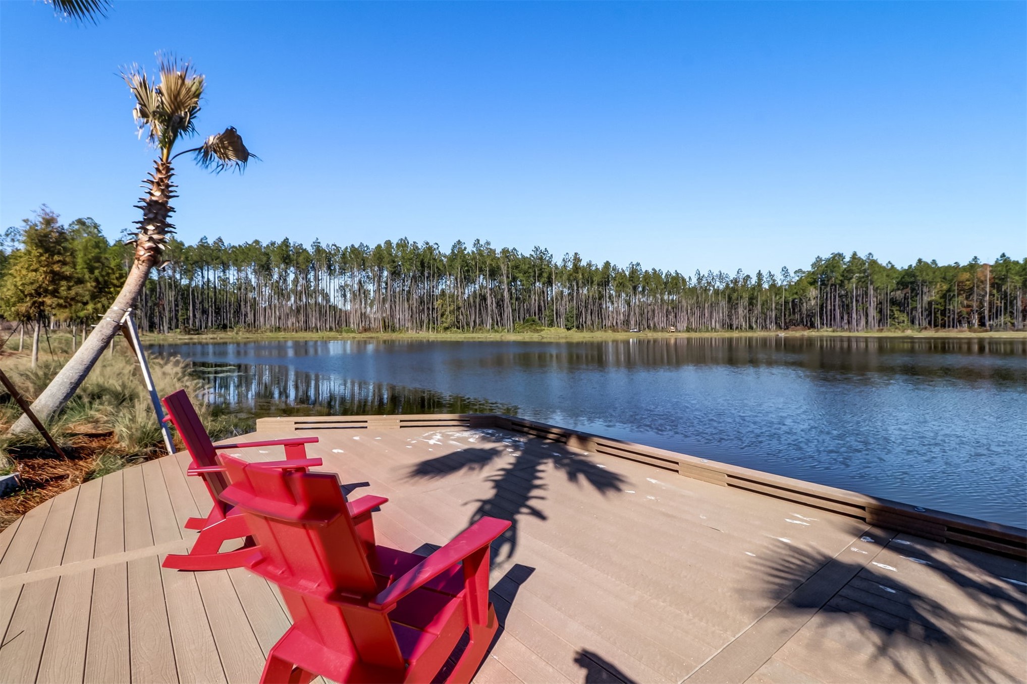 230 Wildlight Avenue Yulee, FL 32097 - Photo 47 of 73 a view of a lake with a table and chairs