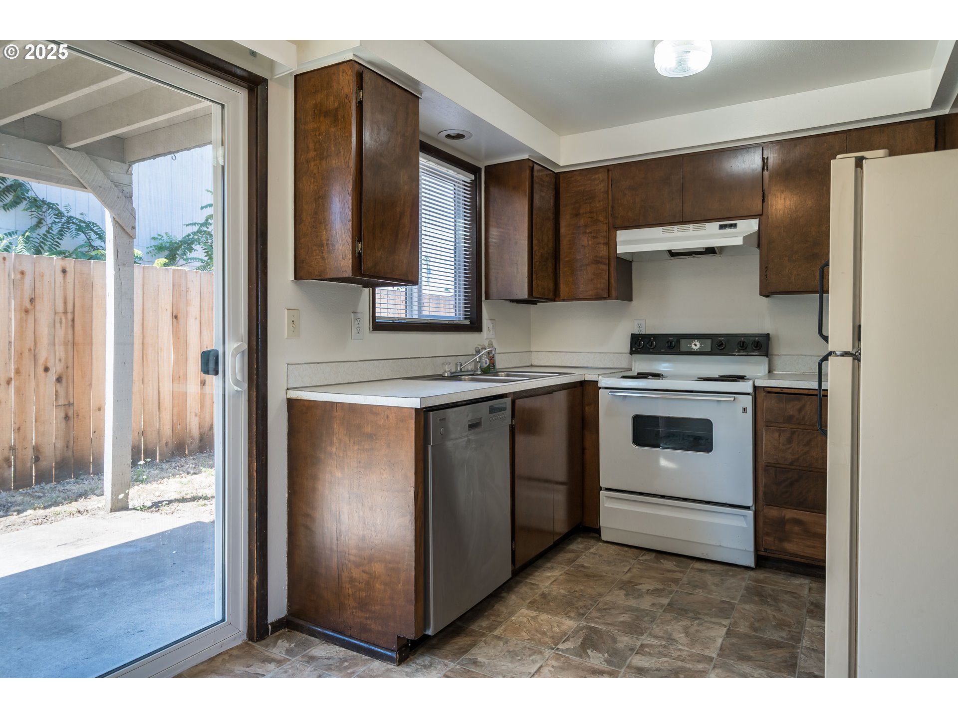 231 South 40th Street Springfield, OR 97478 - Photo 5 of 19 a kitchen with cabinets and stainless steel appliances