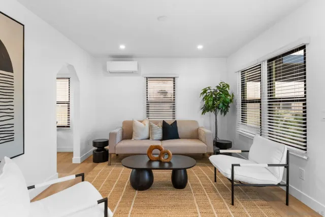 a living room with furniture and a large window