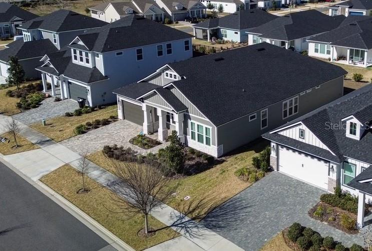 a aerial view of a house with a yard