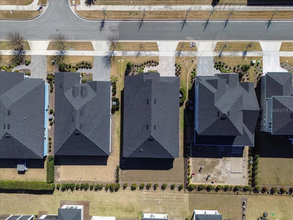 12030 Southwest 32nd Lane Gainesville, FL 32608 - Photo 43 of 57 a aerial view of a house with yard and glass door