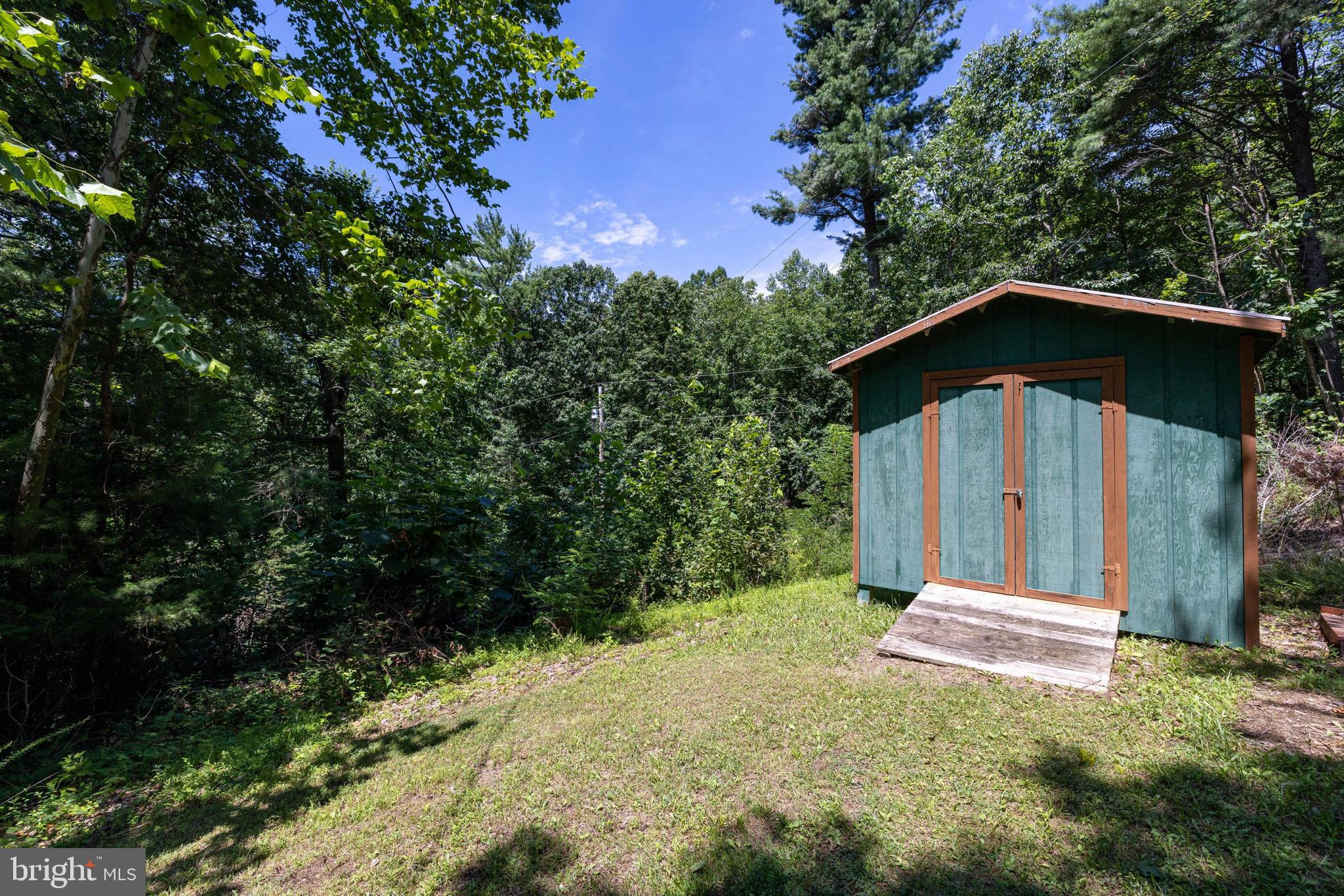 1247 Somers Road Luray, VA 22835 - Photo 26 of 67 a front view of a house with a yard