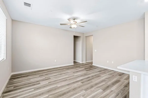 a view of an empty room with a window