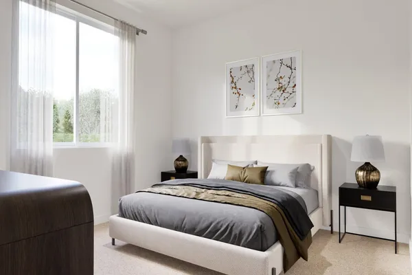 a bedroom with a bed and window