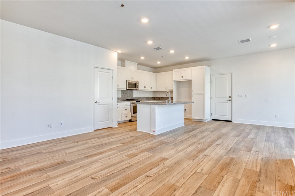 5603 Kate Way Fontana, CA 92336 - Photo 25 of 63 a view of kitchen with wooden floor