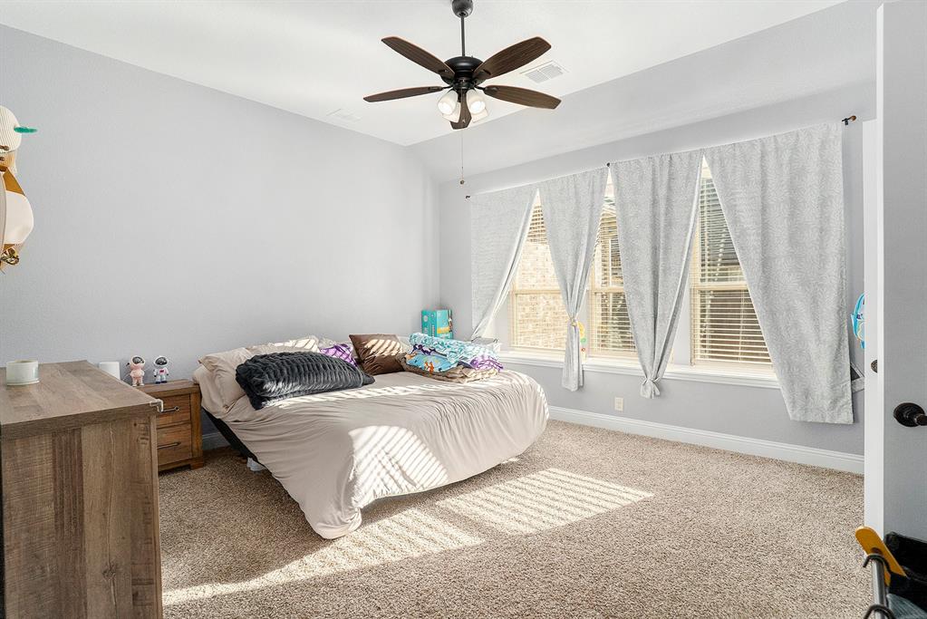 1076 Imperial Eagle Road Alvarado, TX 76009 - Photo 14 of 32 a bedroom with a bed and window