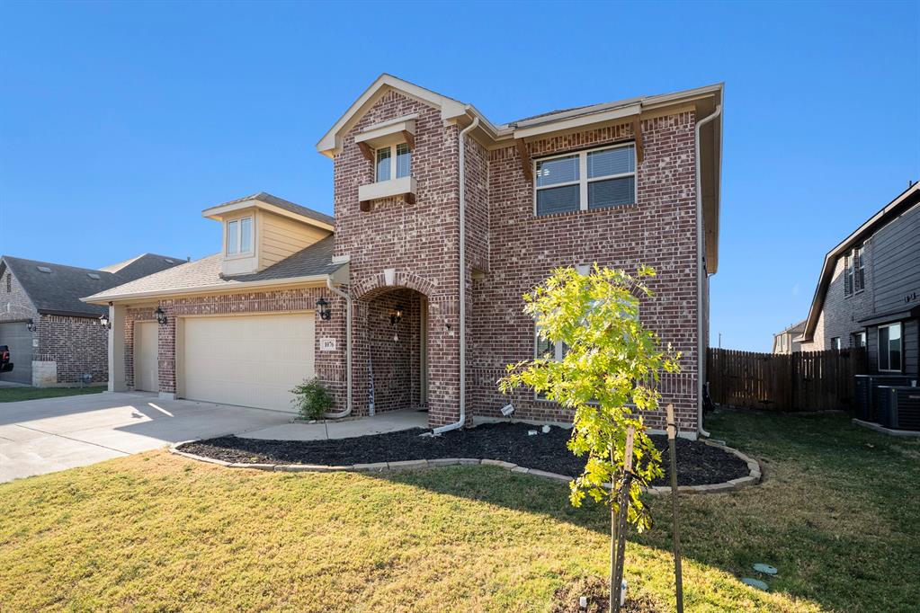 1076 Imperial Eagle Road Alvarado, TX 76009 - Photo 2 of 32 a front view of a house with garden