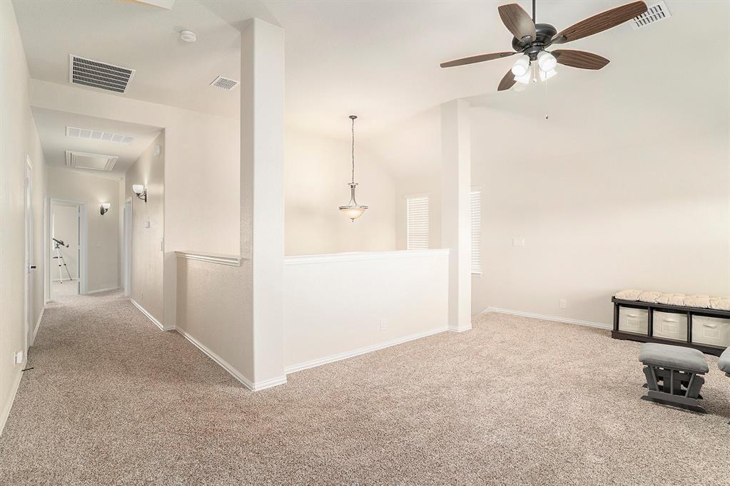 1076 Imperial Eagle Road Alvarado, TX 76009 - Photo 21 of 32 a view of a livingroom with a chandelier fan and kitchen view
