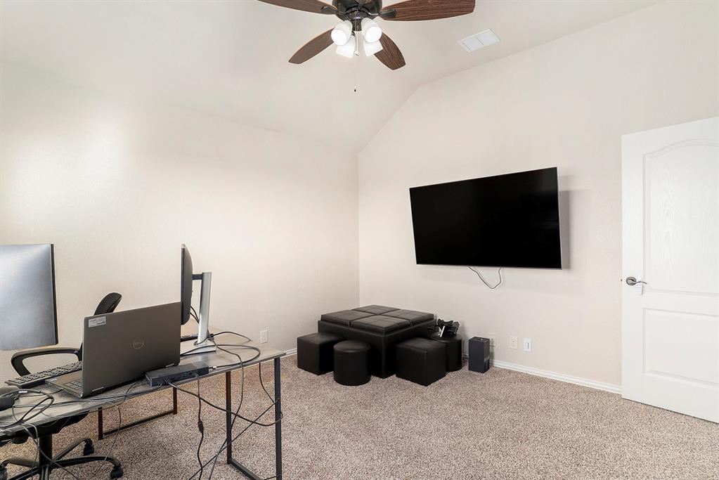 1076 Imperial Eagle Road Alvarado, TX 76009 - Photo 22 of 32 a living room with furniture and a flat screen tv