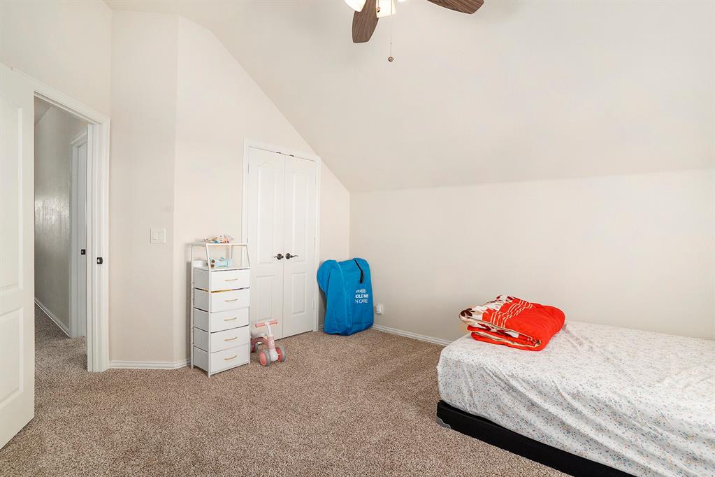 1076 Imperial Eagle Road Alvarado, TX 76009 - Photo 25 of 32 a bedroom with a bed and cabinets