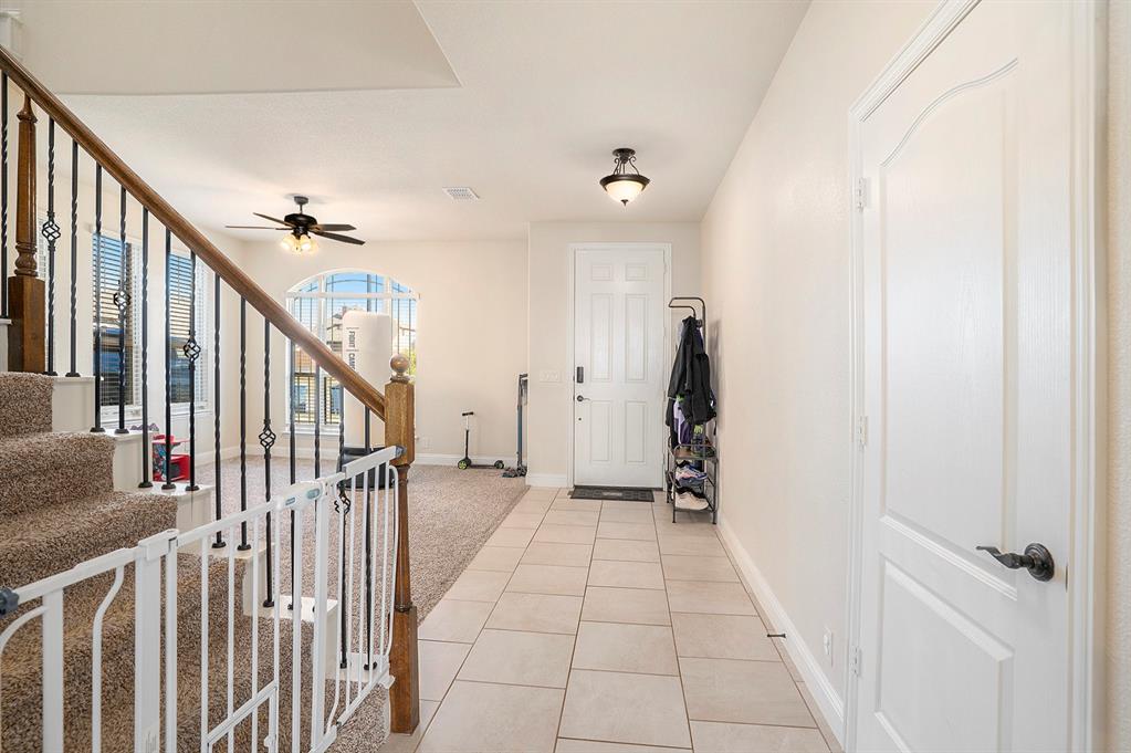 1076 Imperial Eagle Road Alvarado, TX 76009 - Photo 3 of 32 a view of a hallway view with staircase