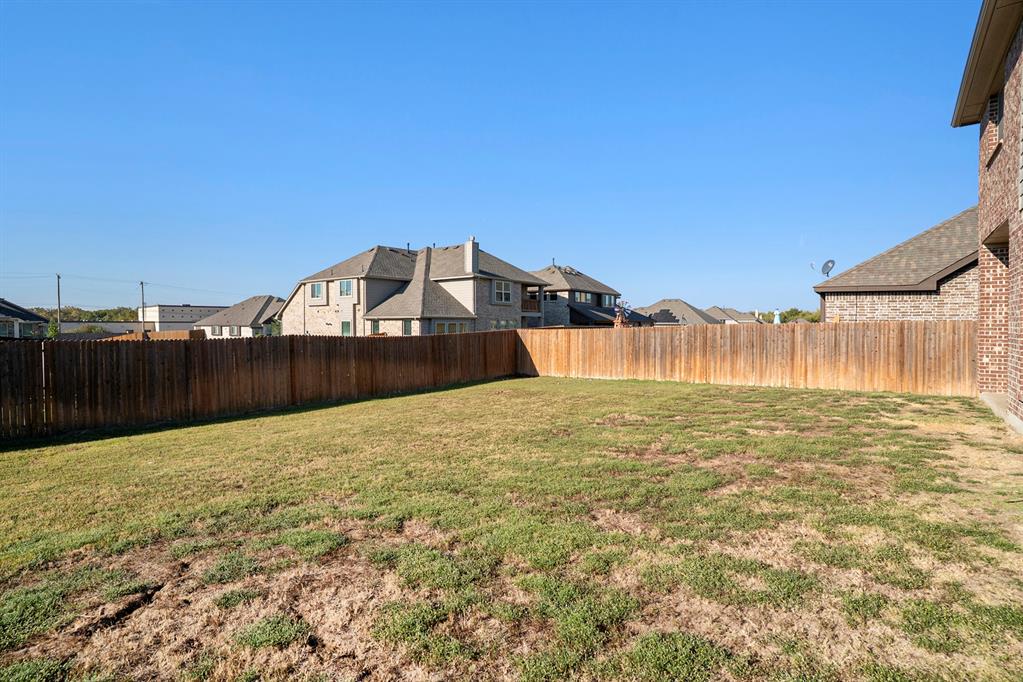 1076 Imperial Eagle Road Alvarado, TX 76009 - Photo 32 of 32 a view of a pool with a yard