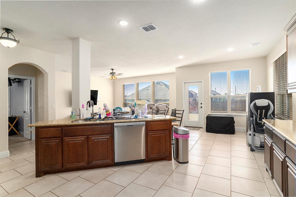 1076 Imperial Eagle Road Alvarado, TX 76009 - Photo 9 of 32 a kitchen with a sink and cabinets