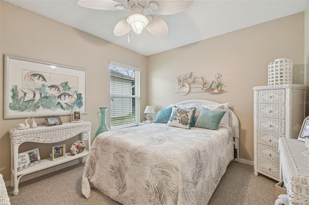 3216 Fox Squirrel Lane Valrico, FL 33596 - Photo 39 of 95 a bedroom with a bed and a painting on the wall