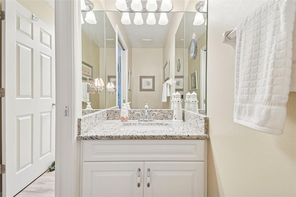 3216 Fox Squirrel Lane Valrico, FL 33596 - Photo 43 of 95 a bathroom with a granite countertop sink and a mirror
