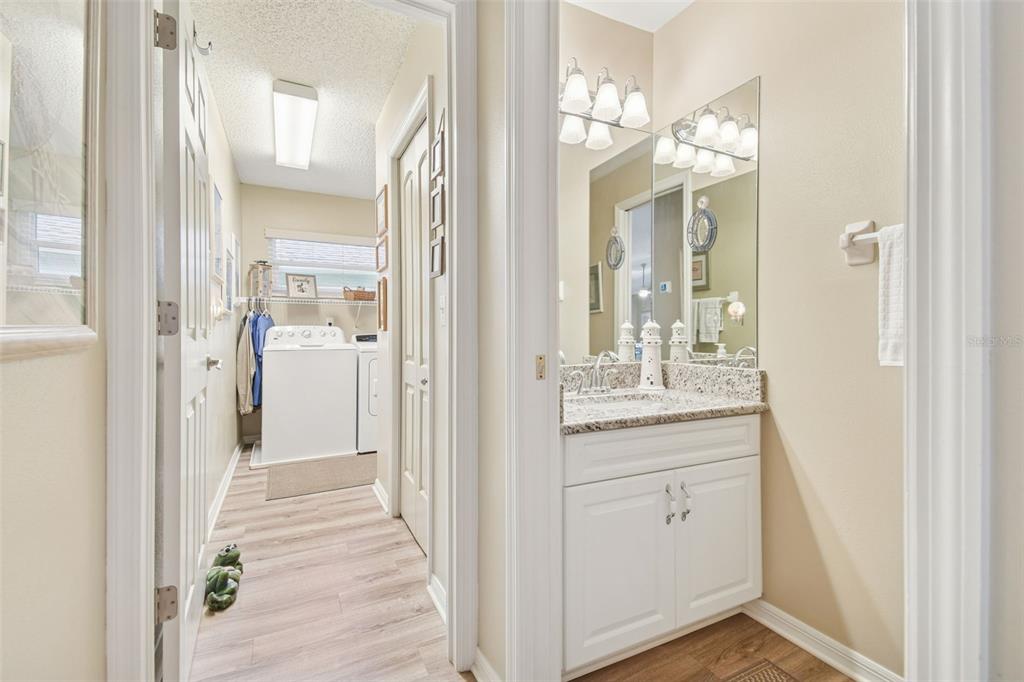 3216 Fox Squirrel Lane Valrico, FL 33596 - Photo 44 of 95 a en suite bathroom with a sink mirror and shower