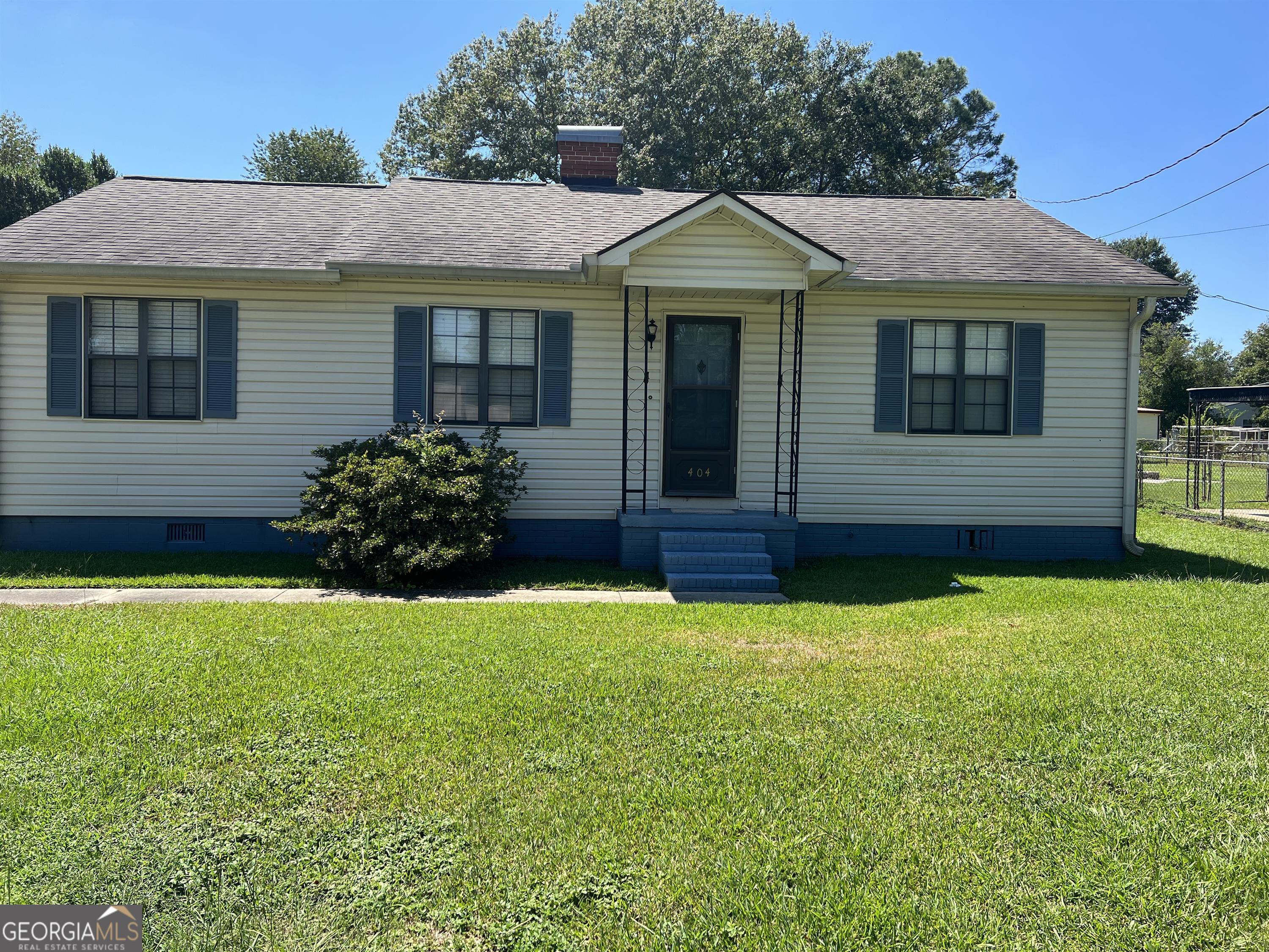 404 McArthur Boulevard Warner Robins, GA 31093 - Photo 1 of 10 a front view of a house with a yard