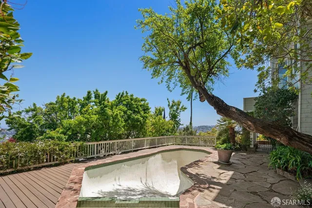 a view of a room that has a large window