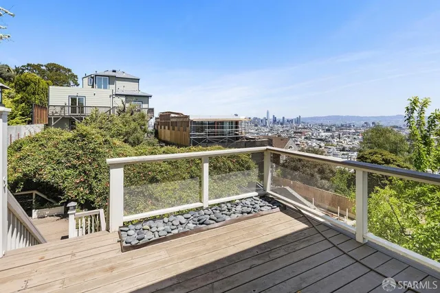 a view of a livingroom with furniture and a fireplace