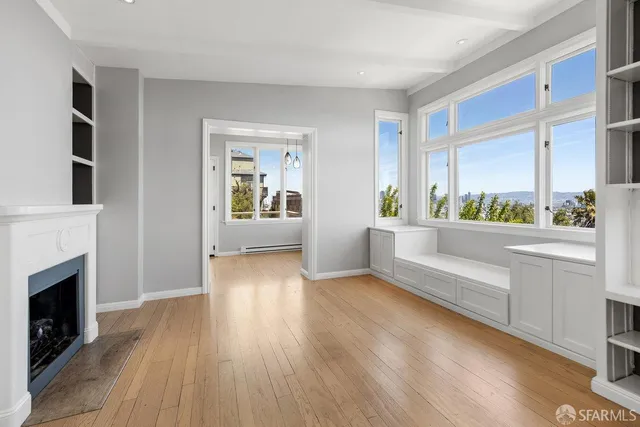 a kitchen with stainless steel appliances and white cabinets