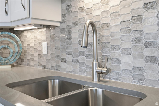 21 Pier Place Tooele, UT 84074 - Photo 56 of 112 Dual basin stainless steel sink with a high-arc brushed nickel faucet