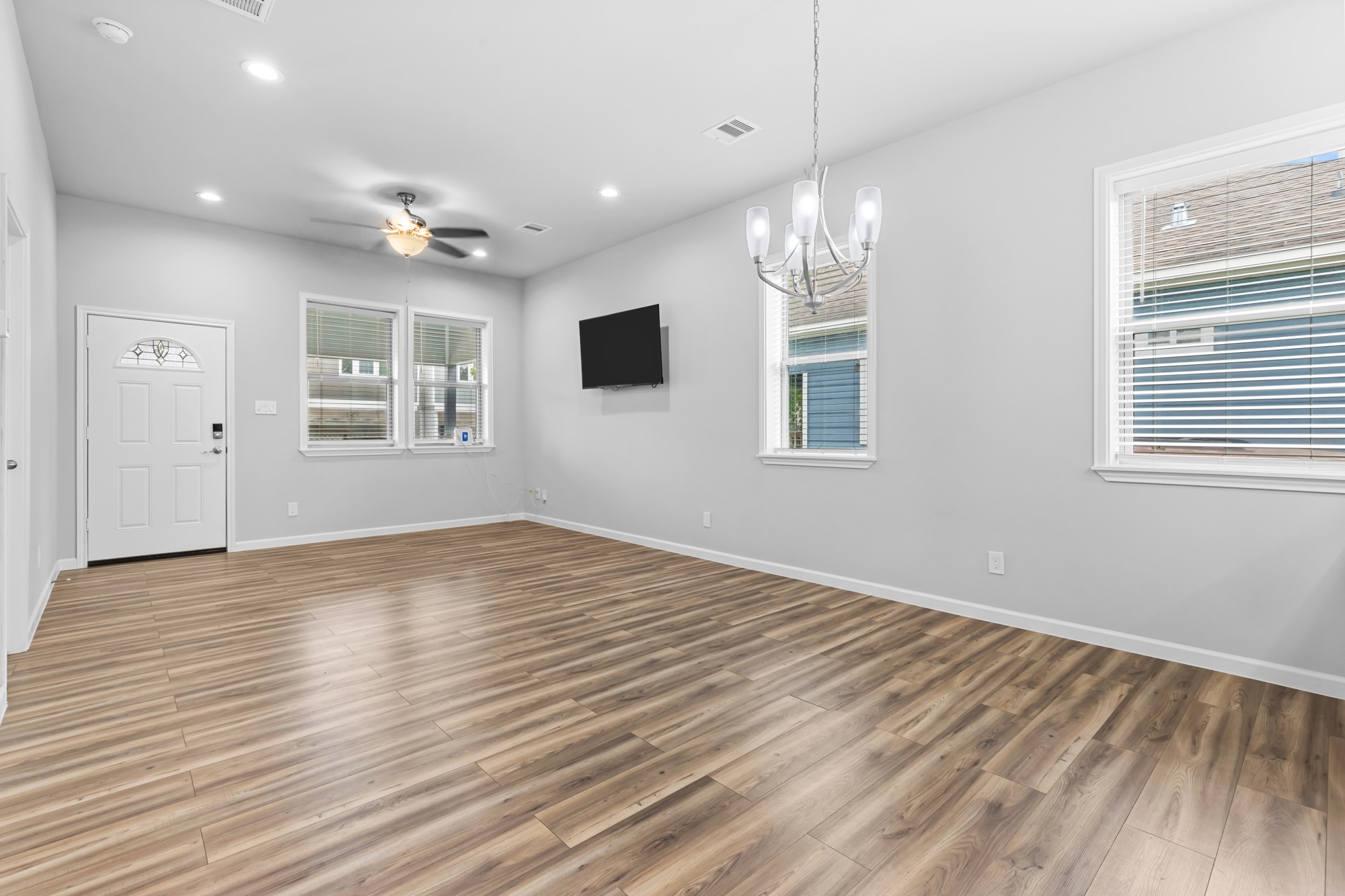 1505 Hussion Street Houston, TX 77003 - Photo 14 of 34 a view of empty room with wooden floor and fan