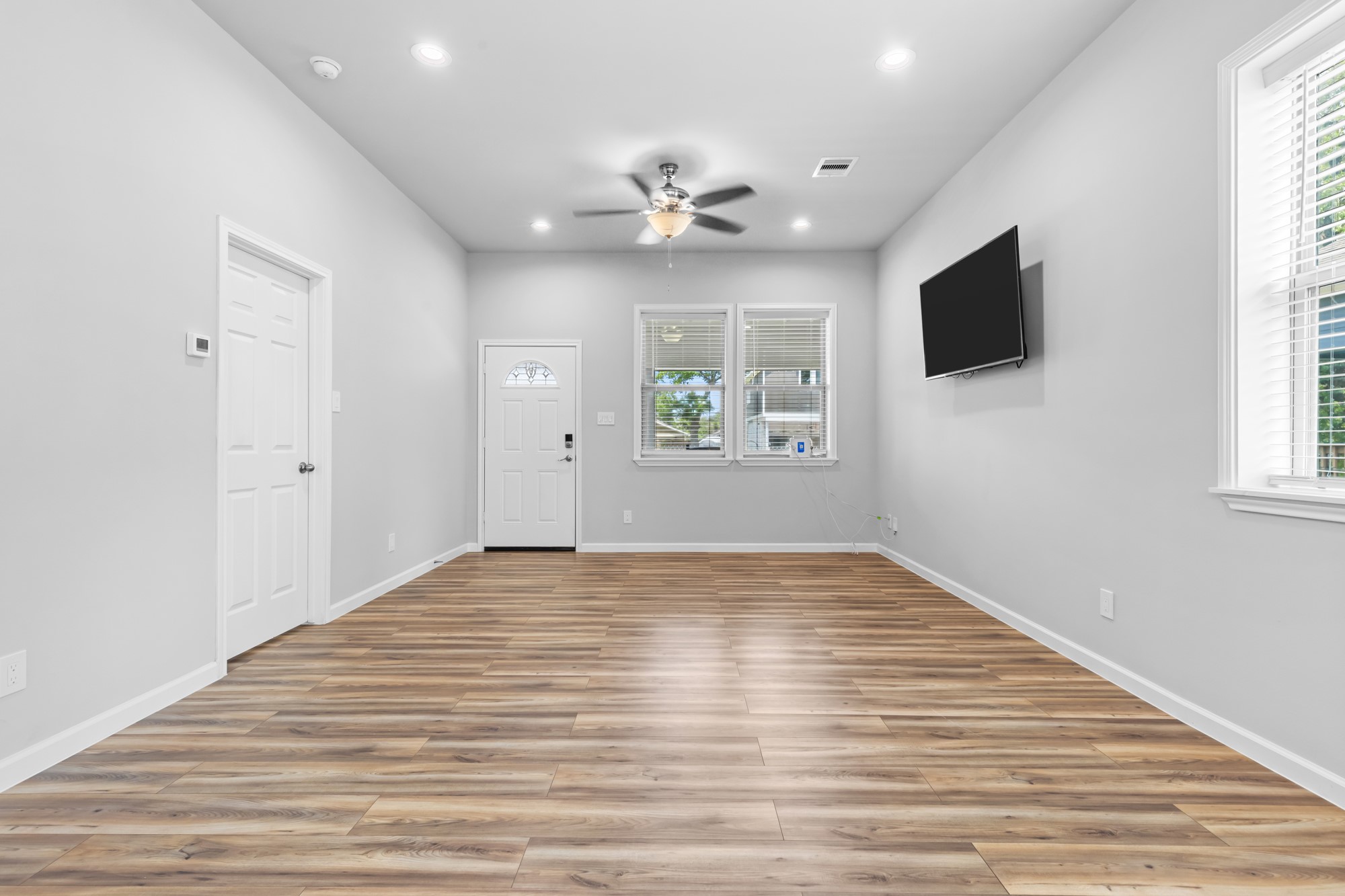 1505 Hussion Street Houston, TX 77003 - Photo 15 of 34 a view of empty room with wooden floor and fan