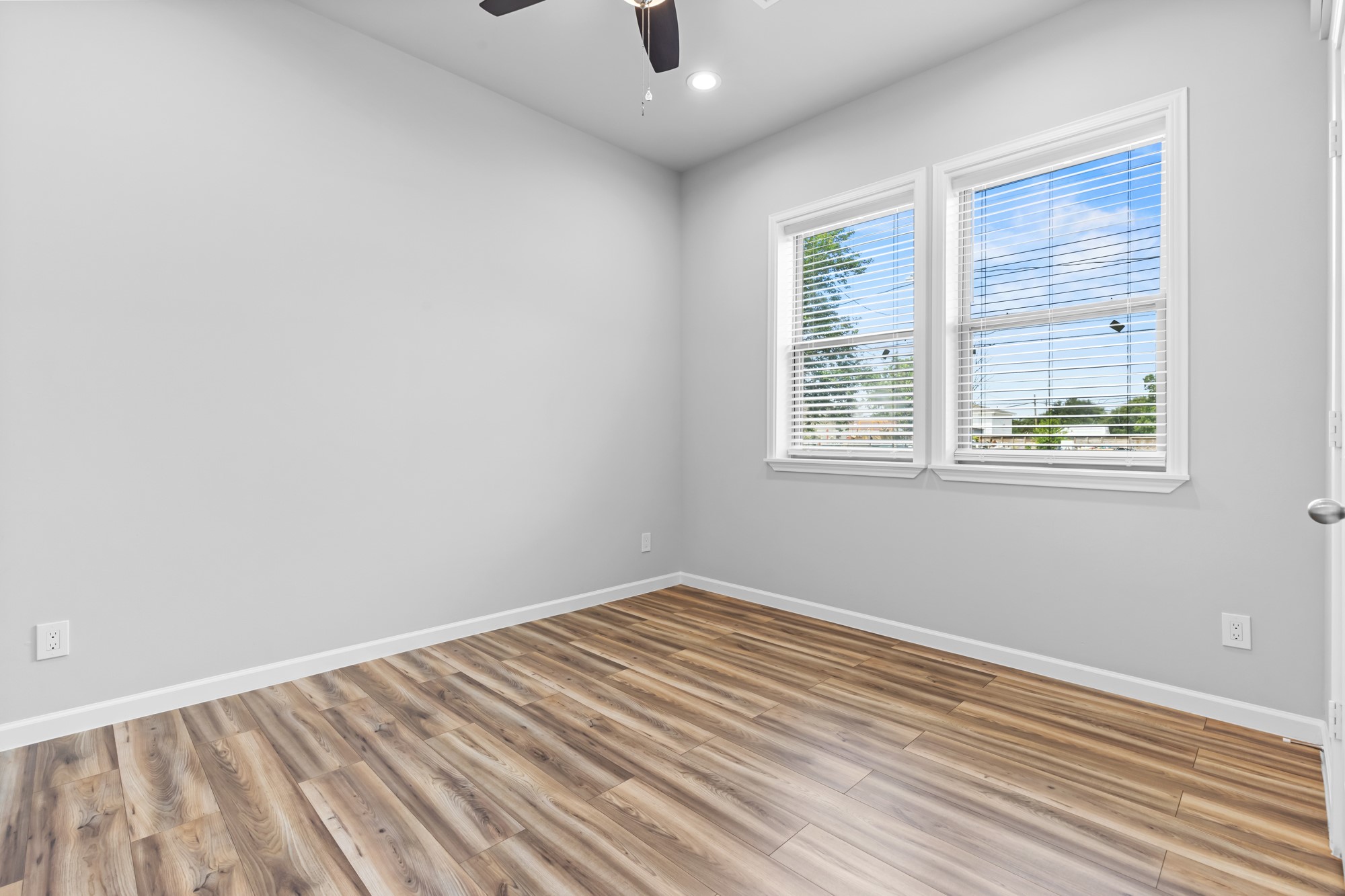 1505 Hussion Street Houston, TX 77003 - Photo 21 of 34 a view of a room with wooden floor and windows