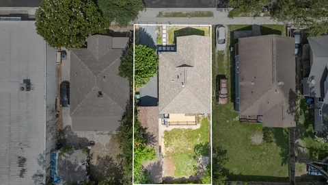 an aerial view of house with pool