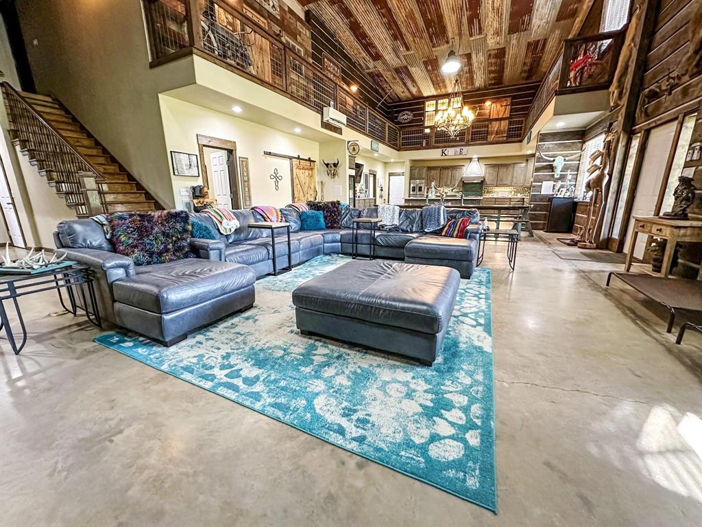 1990 Jim Harry Loop Sunset, TX 76270 - Photo 4 of 39 a living room with patio furniture and a chandelier