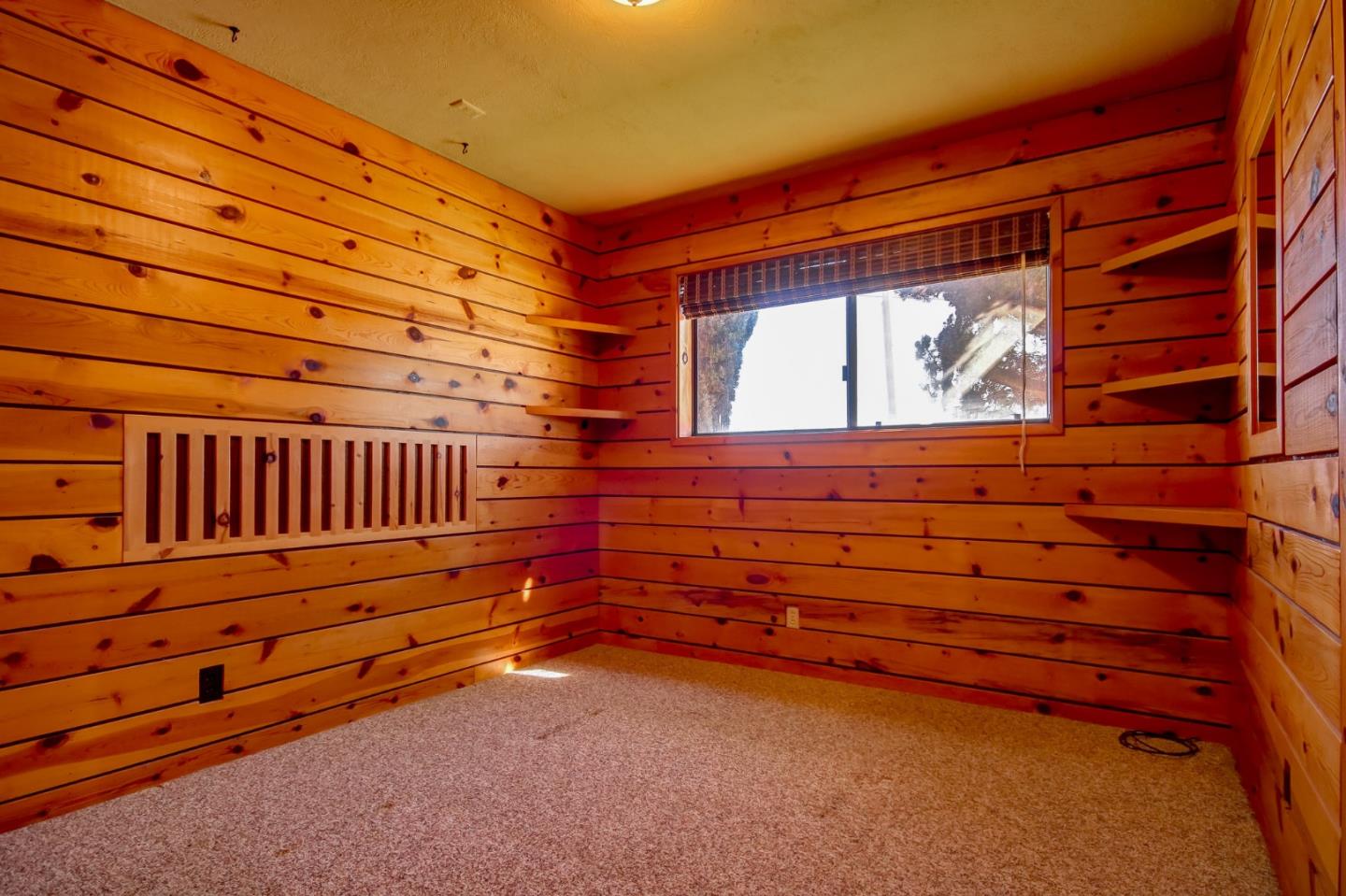 410 Bardin Road Salinas, CA 93905 - Photo 25 of 40 a backyard of a house with wooden stairs and a wooden bench