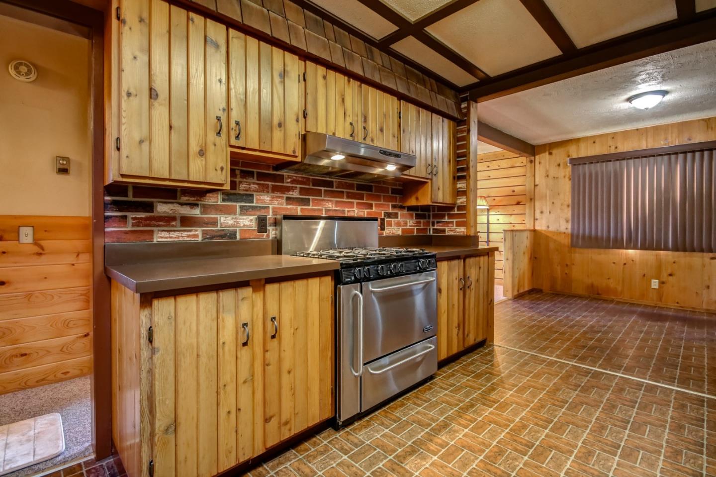 410 Bardin Road Salinas, CA 93905 - Photo 34 of 40 a kitchen with stainless steel appliances granite countertop a stove a sink and a microwave