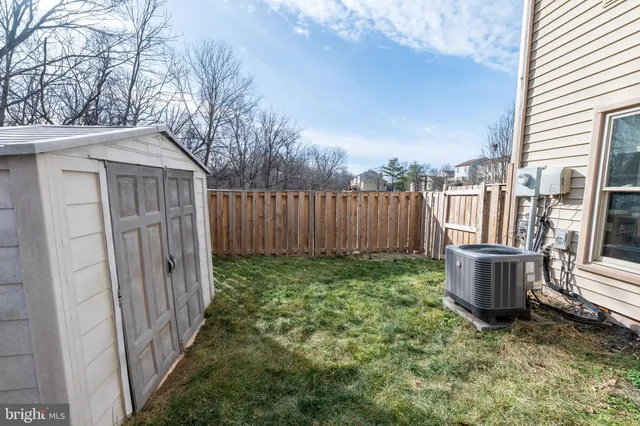 a view of a wooden house with a large door