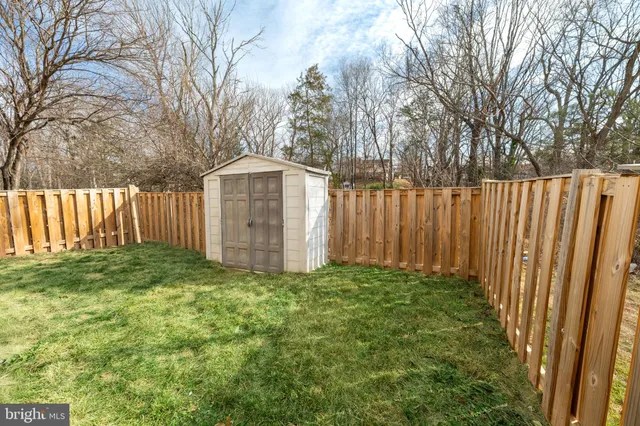 a bathroom with a sink toilet and a mirror