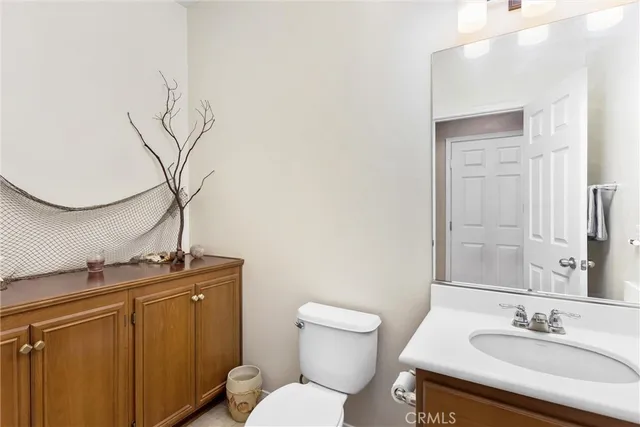 a bedroom with a bed window and a flat screen tv
