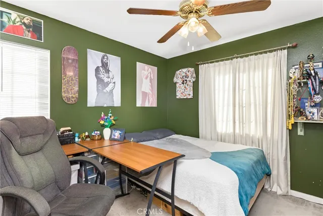 a view of a chairs and table in backyard