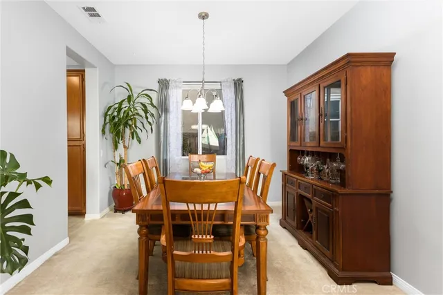 a kitchen with a stove sink and cabinets
