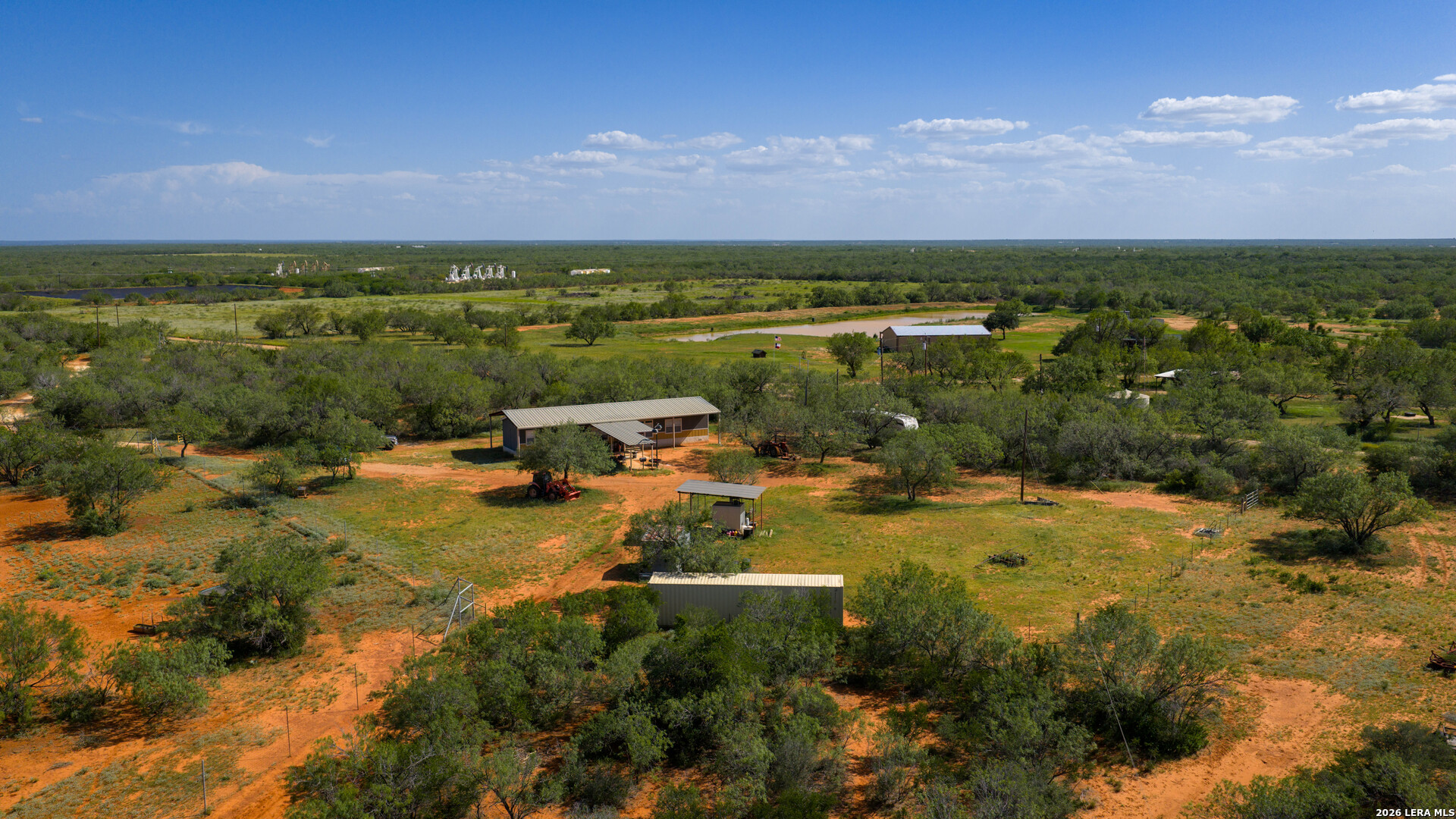 0 Vesper Cotulla, TX 78014 - Photo 19 of 30 a view of a lake with houses in the back